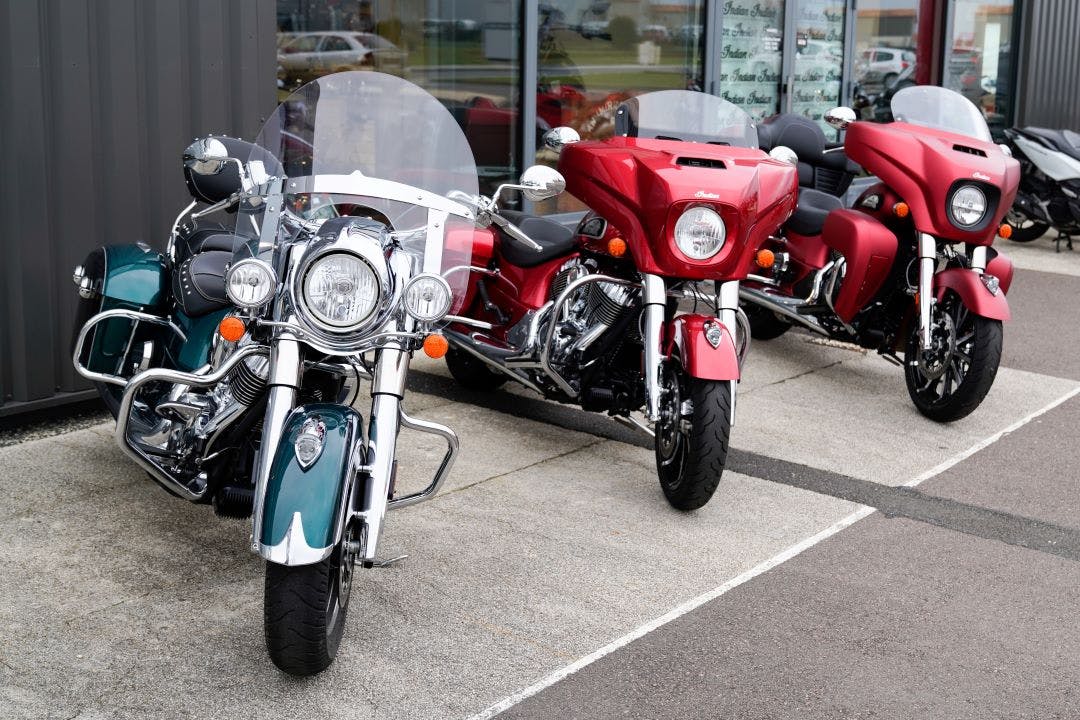 group of indian motorcycles parked in front of a dealership the best indian touring motorcycles