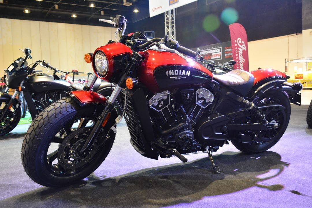 picture of an indian scout motorcycle parked at an expo comparison of indian scout vs. indian chief motorcycles