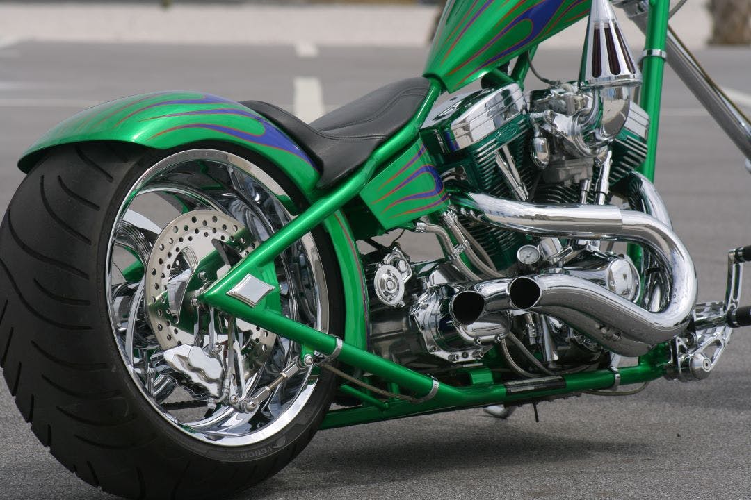 picture of a green custom motorcycle at a rally what to expect at a motorcycle rally