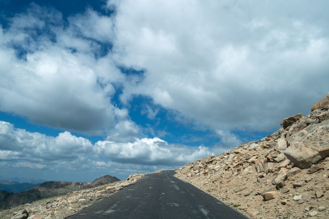 Narrow paved road near the summit of Mt. Evans Scenic Byway the highest paved road in North America Your Colorado Motorcycle Adventures Await