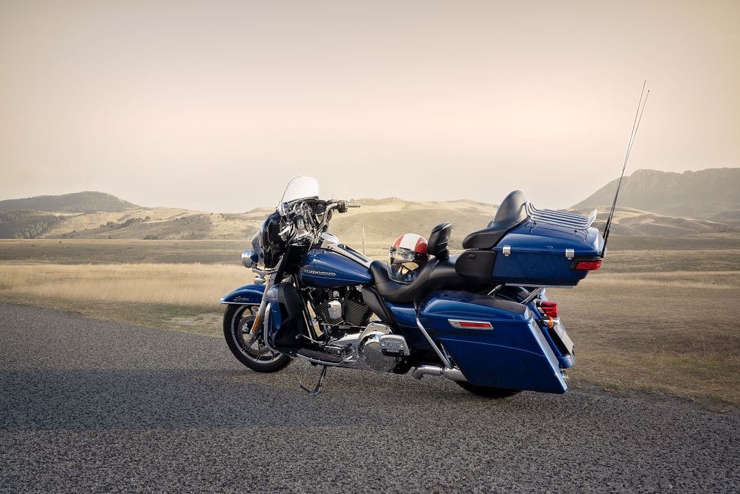 harley davidson road glide back side view sitting on side of road Tips for Touring on a Harley-Davidson