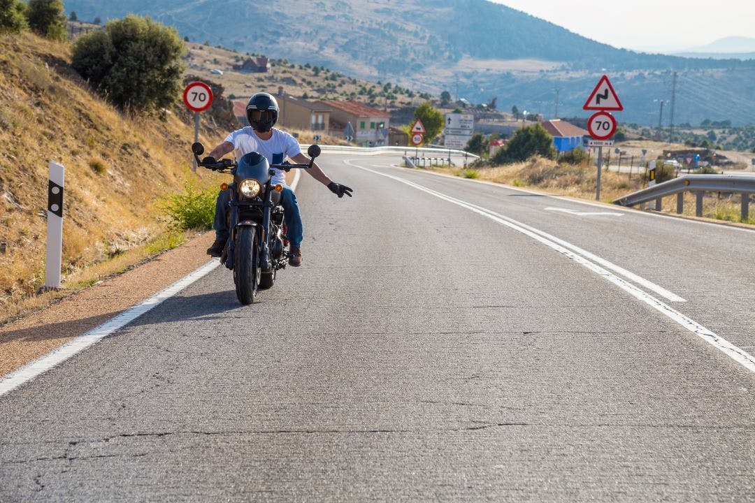 biker wave Motorcycle Hand Signals You Should Know