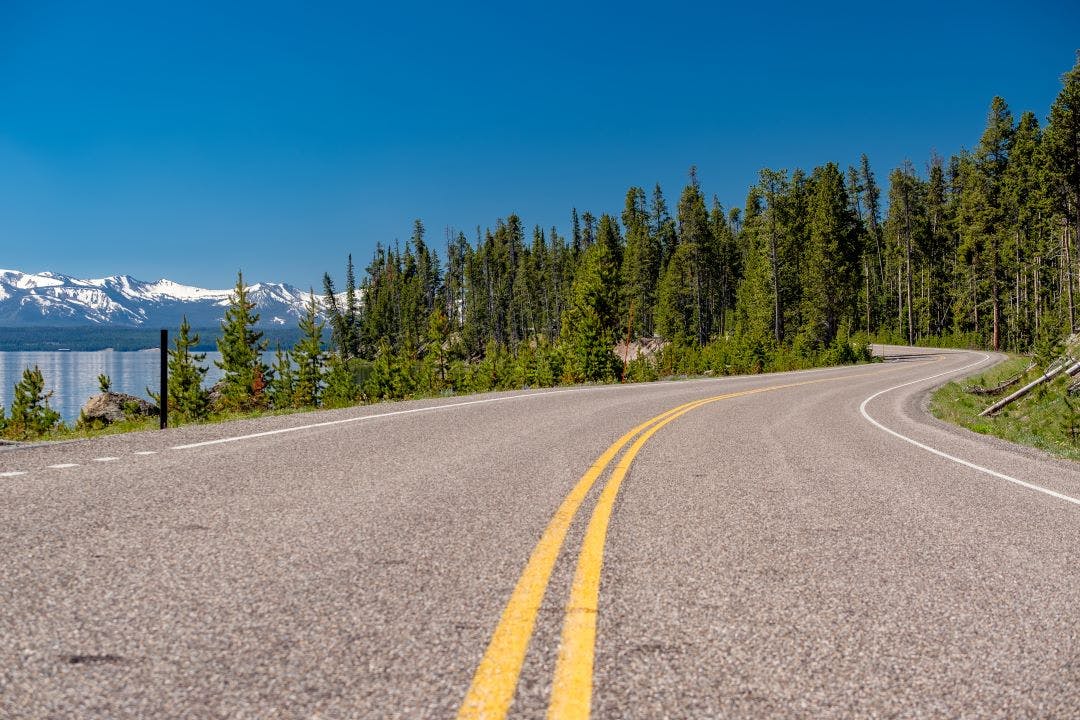 Highway by the lake in Yellowstone Yellowstone National Park on Two Wheels