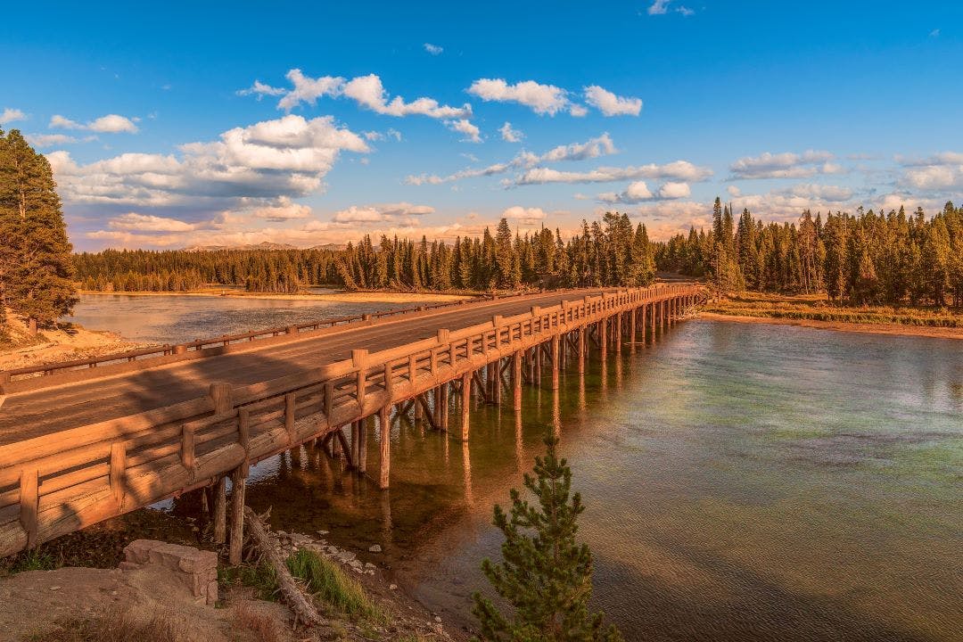 Fishing Bridge over Yellowstone river at sunset.Yellowstone National Park.Wyoming.USA Yellowstone National Park on Two Wheels