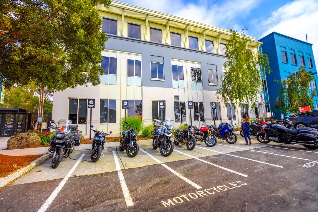 Menlo Park motorbike parking for employees in front of the colorful buildings San Francisco bay San Francisco Bay Area Motorcycle Events, Rides, & Meetups