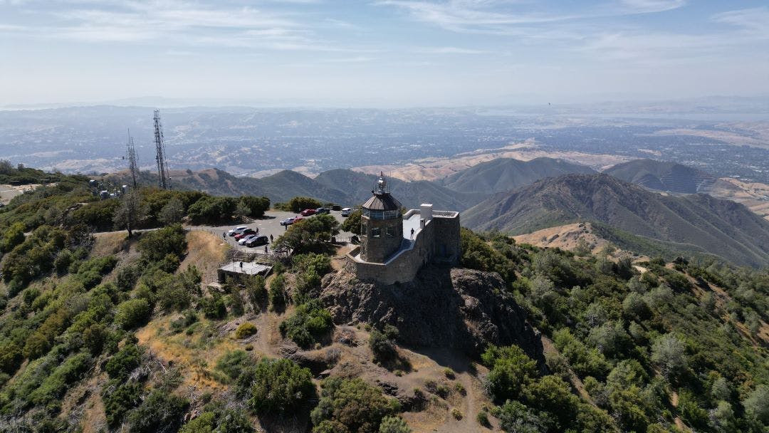 Aerial view of a large building situated atop Mount Diablo, surrounded by lush greenery  Discover the Most Worthwhile Day Trips from the San Francisco Bay Area