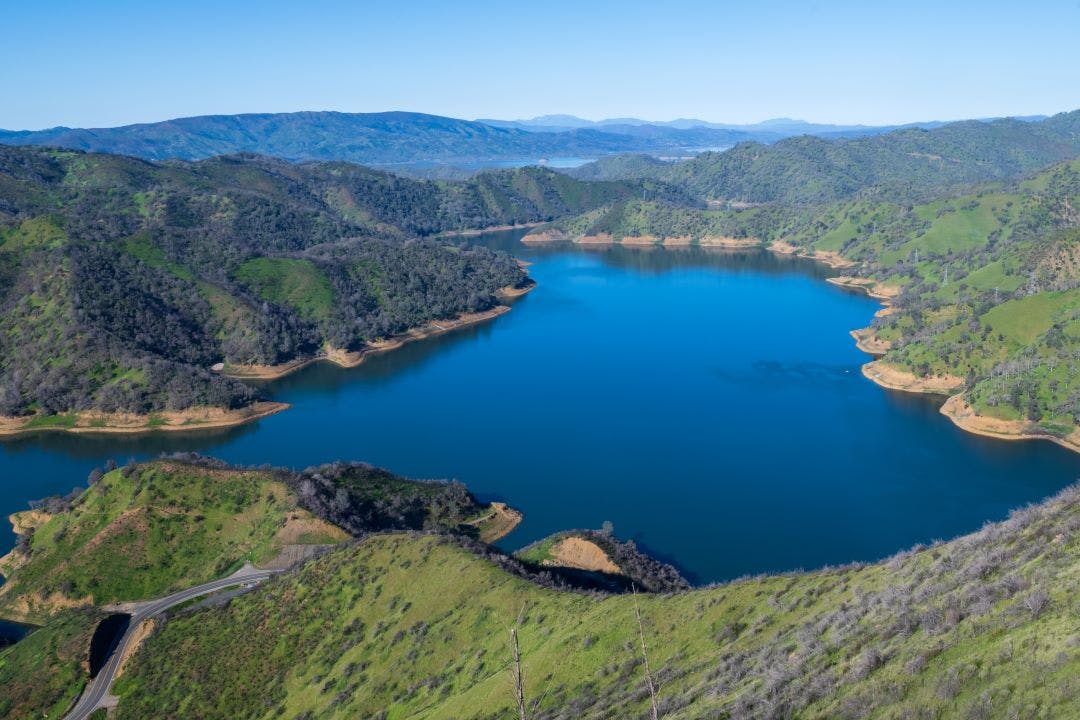 Aerial vew of Lake Berryessa from the Blue Ridge Trail on a sunny day, featuring the reservour and the surrounding blue oak woodland Best Motorcycle Rides in the San Francisco Bay Area - Part 2