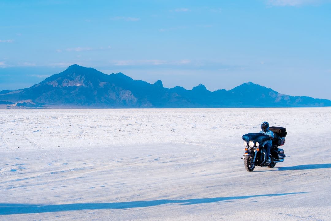 Biker driving across Bonneville Salt Flats in Utah, USA Bonneville Motorcycle Speed Trials 2024 Information