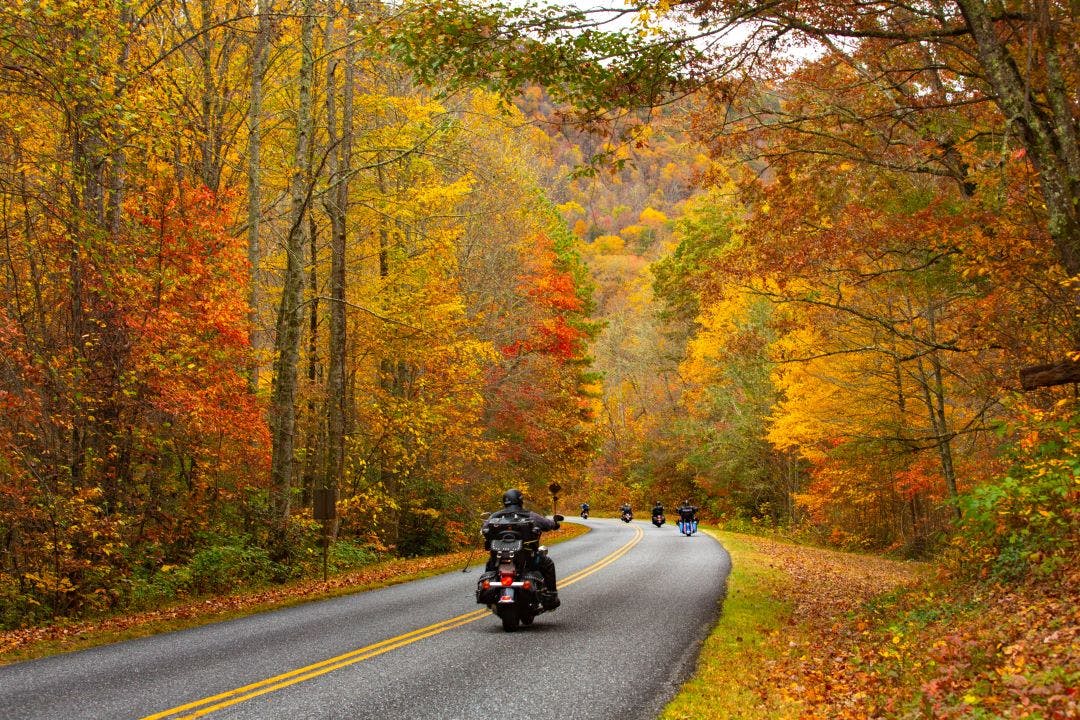 Motorcycle Riders on Blue Ridge Parkway in Autumn Best End of Summer Motorcycle Destinations to Plan ASAP