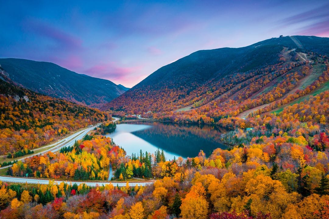 Beautiful fall colors in Franconia Notch State Park White Mountain National Forest, New Hampshire, USA Best End of Summer Motorcycle Destinations to Plan ASAP