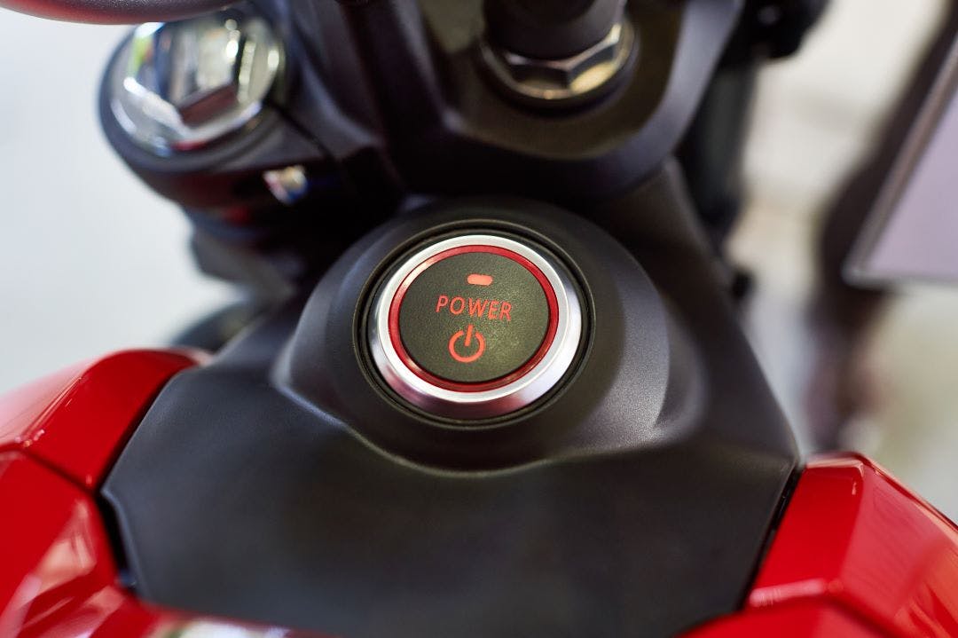 Button POWER on the dashboard of electric motorcycle Best Electric Motorcycles of 2024-2025