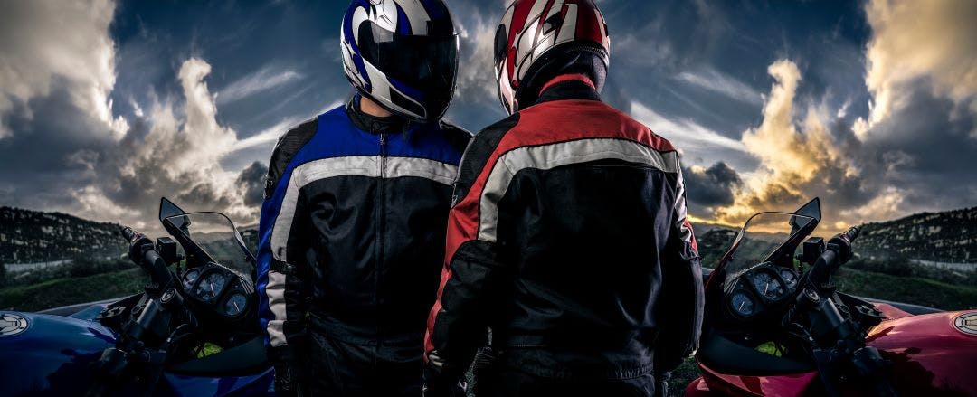 HDR composite of bikers or motorcycle riders with motor bikes on a road. The men depict a club or are competitors in a race. The image depicts racing and motorsports riders share vs twisted road, twisted road vs riders share, eaglerider vs riders share, eagleshare vs riders share