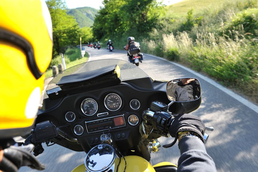 motorcycle group on road Choosing a Guided Motorcycle Tour that Matches Your Speed