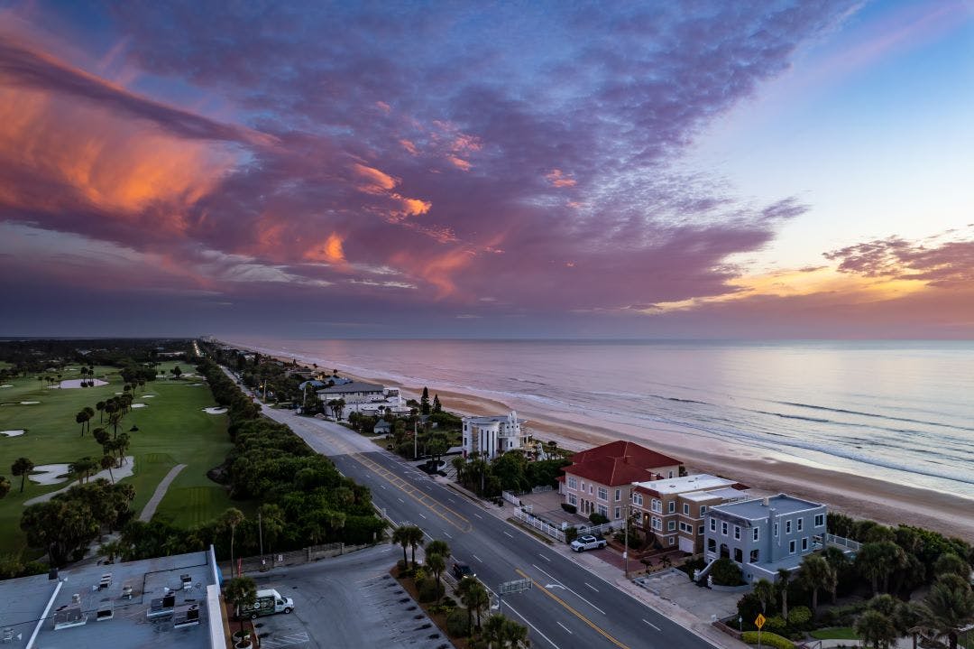 Aerial drone photo of the shore in Ormond Beach, Florida at sunrise In The Area? 5 Great Motorcycle Rides in Daytona Beach