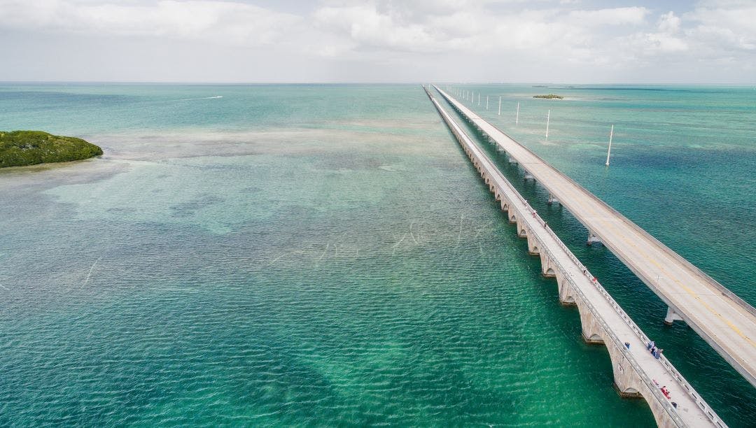 Beautiful aerial view of Overseas Highway Bridge, Florida 10 Most Memorable Self-Guided Motorcycle Tours in the USA