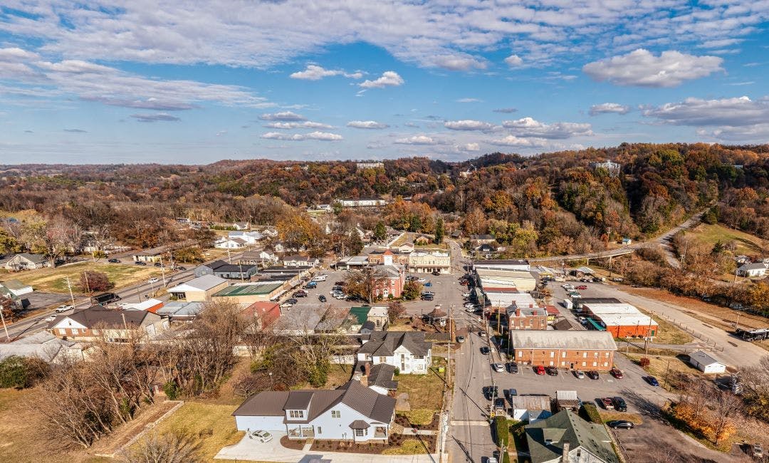 Aerial panorama view of a small southern town square with whiskey barrel houses on the hill and autumn colors in Lynchburg Tennessee USA Your Guide to an Unforgettable Tennessee Road Trip