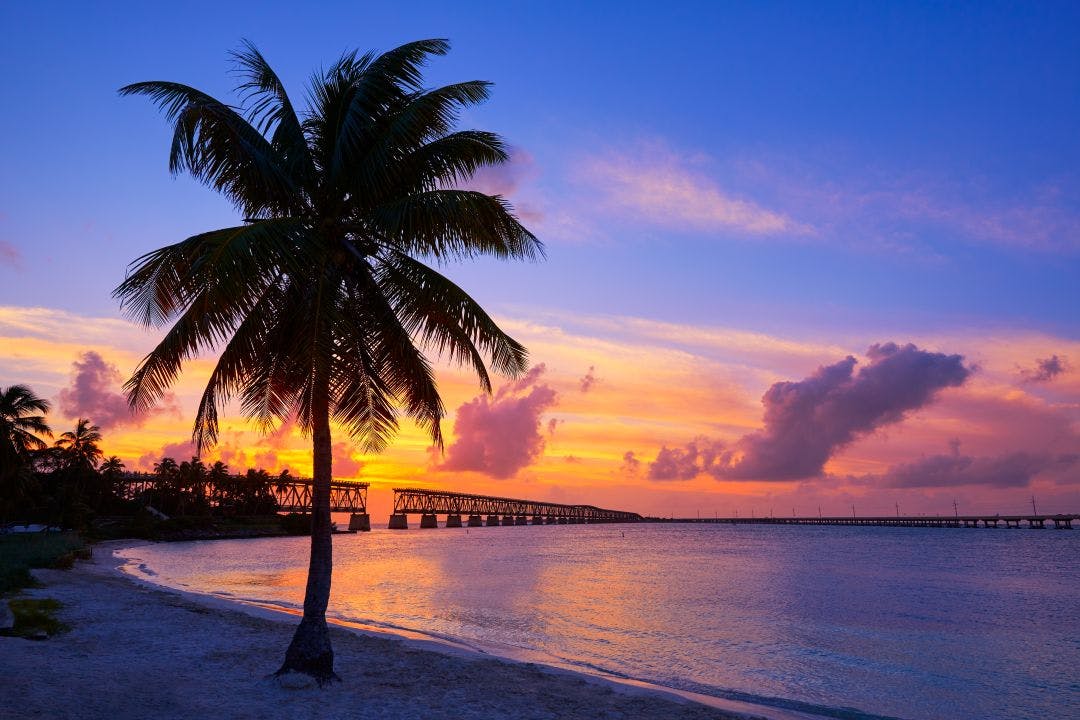 Florida Keys old bridge sunset at Bahia Honda Best States to Ride a Motorcycle Year-Round