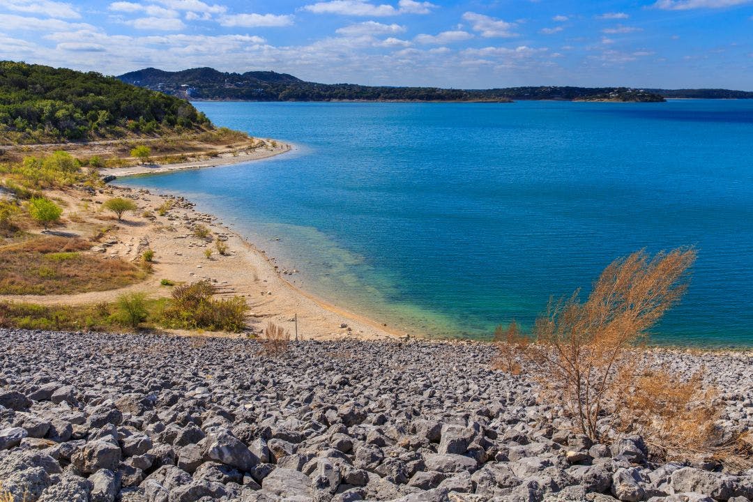 Canyon Lake close to San Antonio, New Braunfels, San Marcos and Wimberley in the Texas hill country. It is part of the Guadalupe River. You can walk on the dam. There are many beaches on the shores Ride the Gruene-Fredericksburg-Bandera Loop