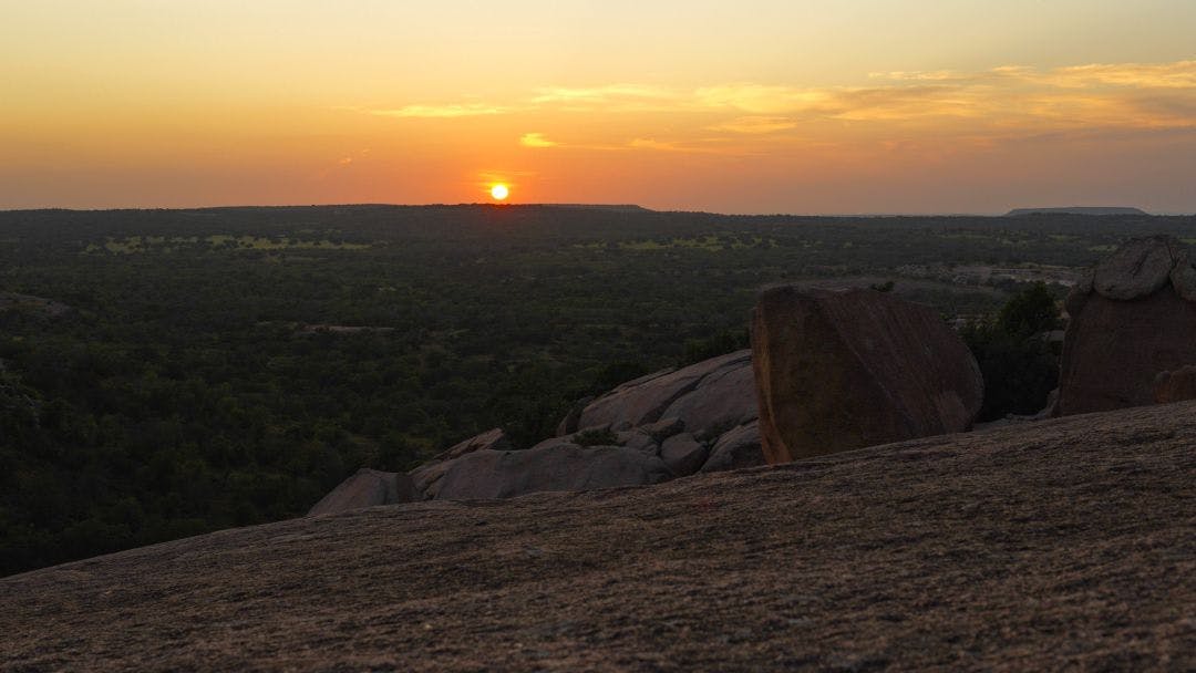 Sunset from Enchanted Rock located in the Texas Hill Country, USA Best 15 Day Trips from San Antonio, Texas