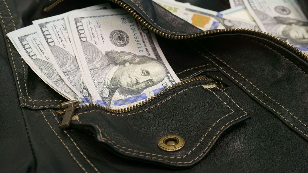 How Can I Find Out What My Motorcycle Is Worth?leather jacket with hundred dollar bills in pocket 