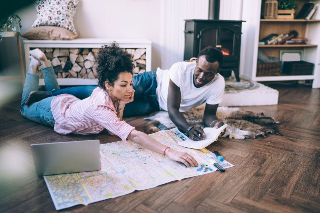 couple planning trip together Your 2025 Summer Motorcycle Travel Guide