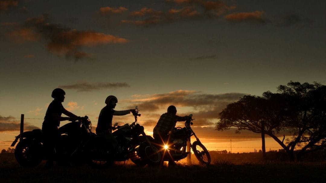 motorcyclists enjoy the sky in late afternoon How to List a Motorcycle Tour on Riders Share & Make Money