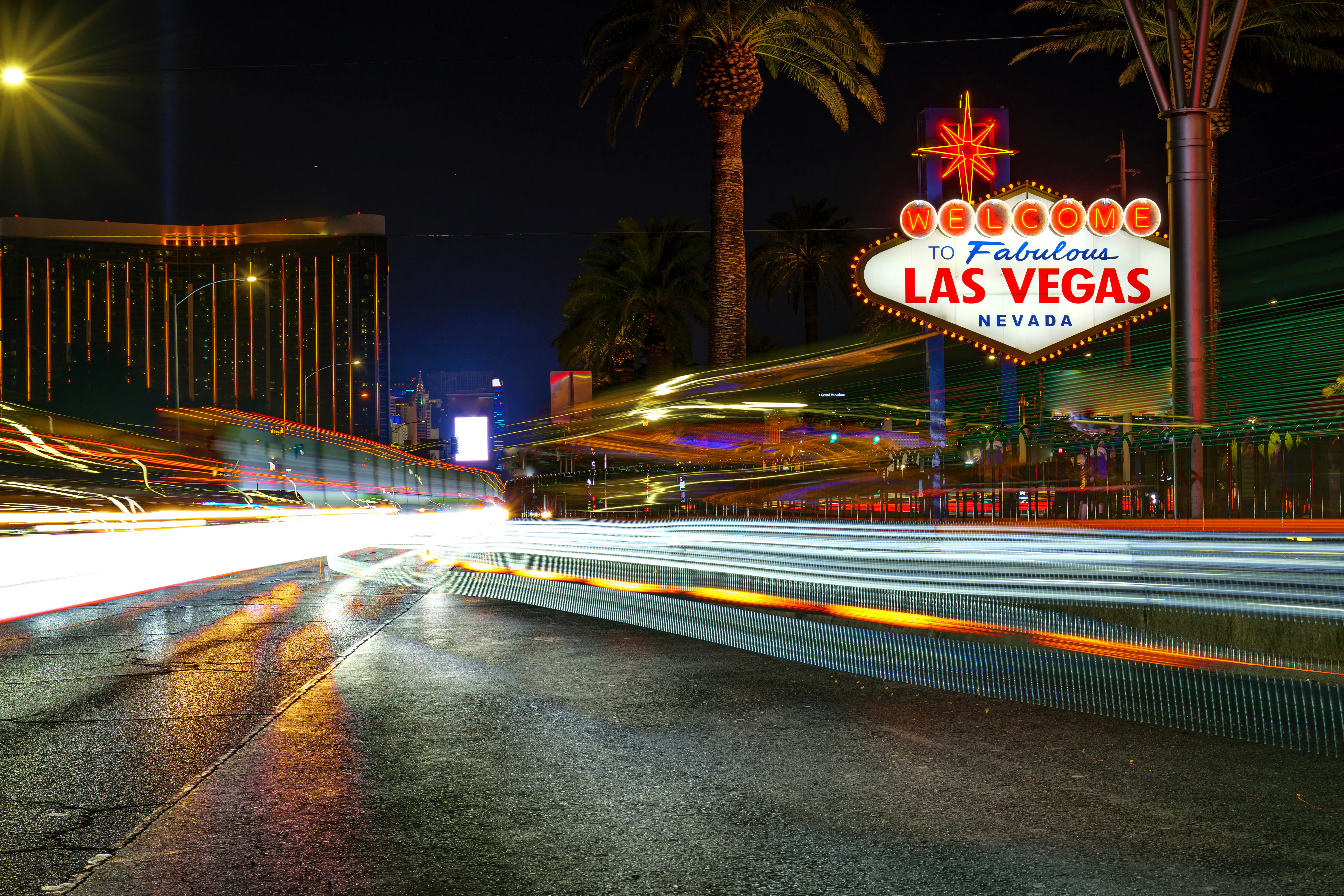 las vegas motorcycle rentals riders share, image of famous las vegas sign at night 