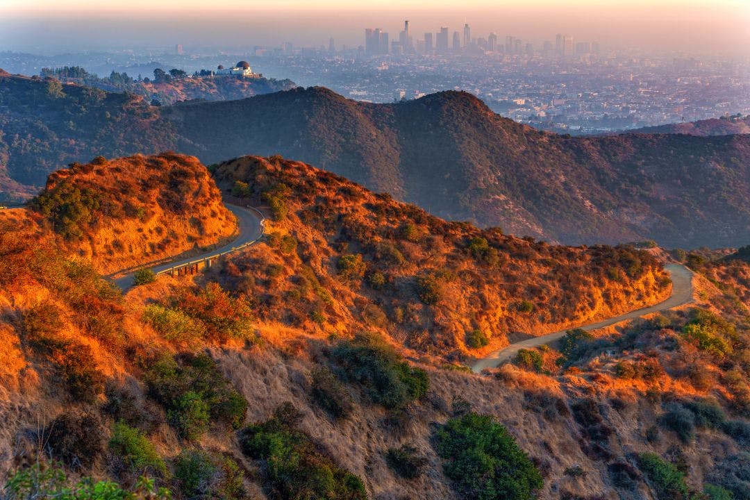 winding hiking roads through griffith park at sunset overlooking downtown los angeles 50 Experiences for the Your California Bucket List