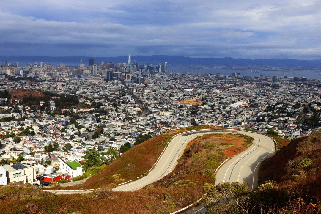 san francisco california skyline from twin peaks and curved road Alice's Restaurant | Bay Area Motorcycle Destination