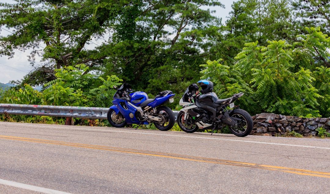 two motorcycles parked on the side of the road on dragons tail north carolina The Rattler NC 209: Complete Motorcycle Route Guide