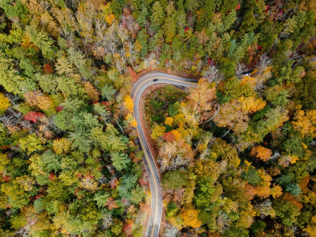 aerial view of the tail of the dragon road near the tennessee and north carolina border in the smoky mountains in the fall The Rattler NC 209: Complete Motorcycle Route Guide