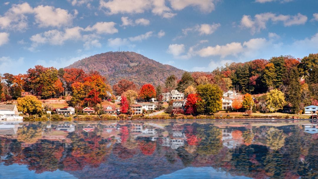 fall landscape showing lake houses with reflections in lake junaluska north carolina The Rattler NC 209: Complete Motorcycle Route Guide
