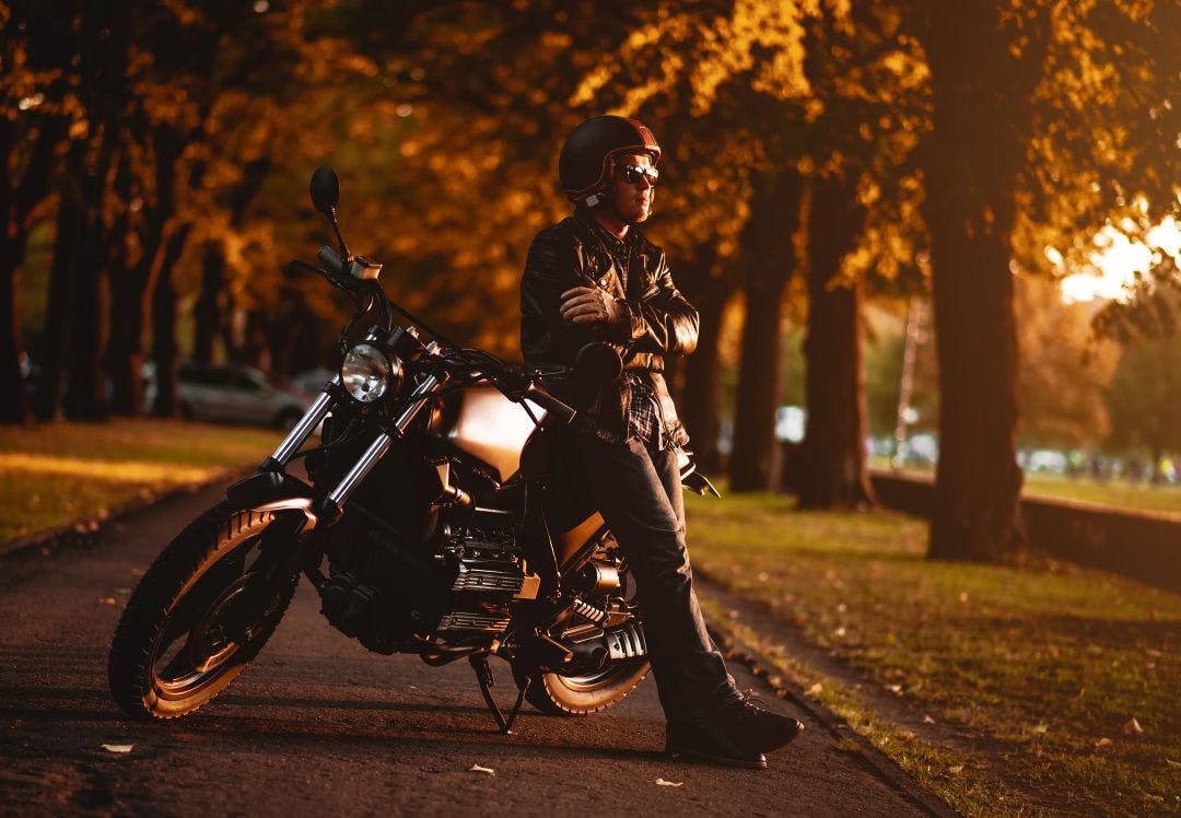 motocyclist with a cafe-racer motorcycle outdoor Are Motorcycle Sales Declining? The Truth