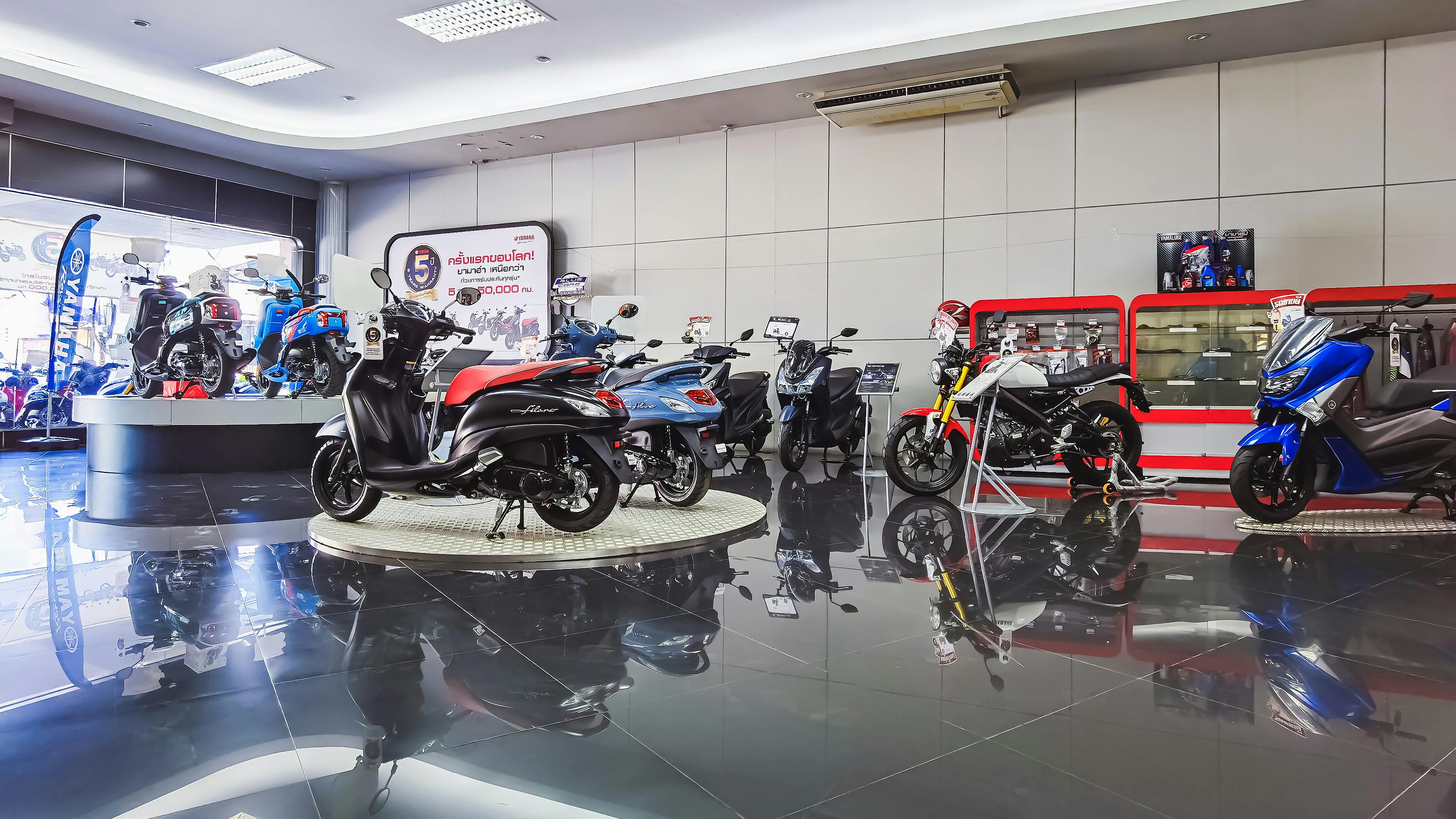 image credit: JinnaritT - stock.adobe.com, image of motorcycle showroom - find the best motorcycles for short riders in 2026