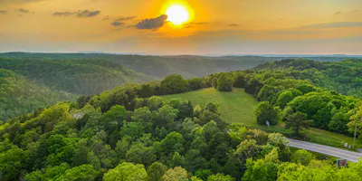 image of Sunset over the Ozark Mountains in Arkansas - book an arkansas motorcycle rental with Riders Share