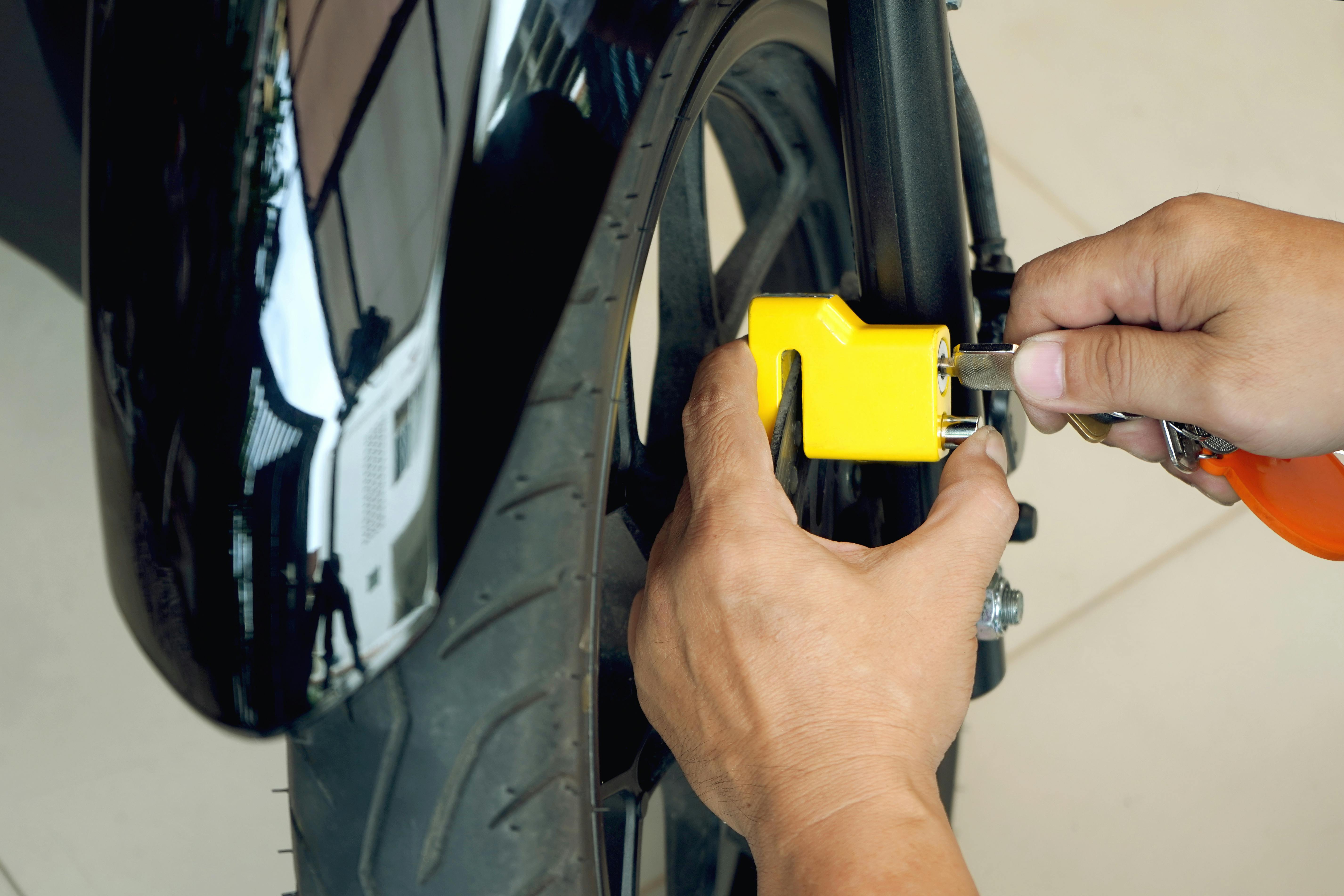 image of motorcycle being locked - motorcycle theft statistics, motorcycle theft prevention