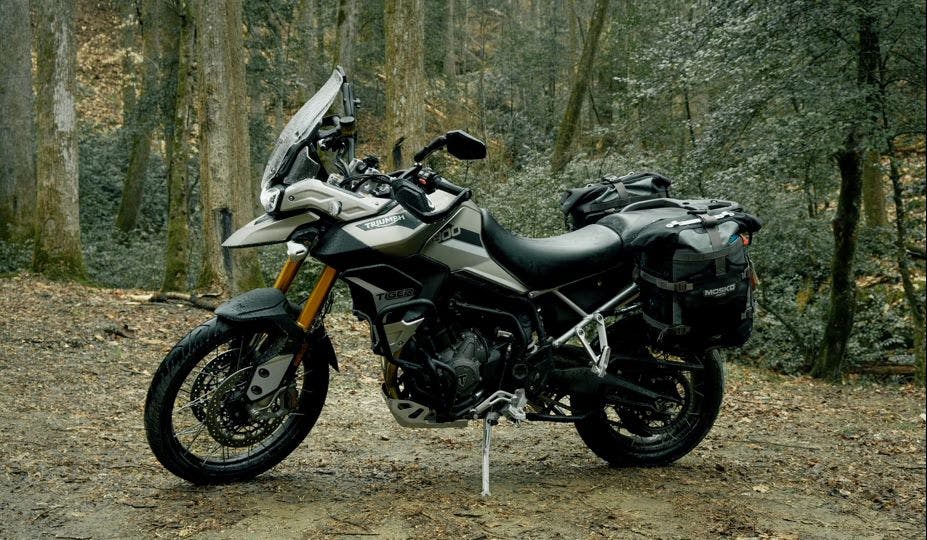 best two seat motorcycles picture of a Triumph Tiger 1200 parked in the woods