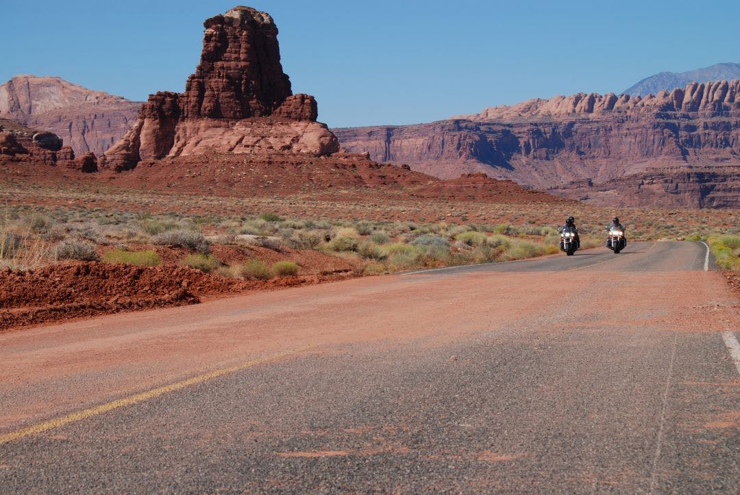 picture of two cruiser motorcycles riding on a highway in the desert best cruiser motorcycles