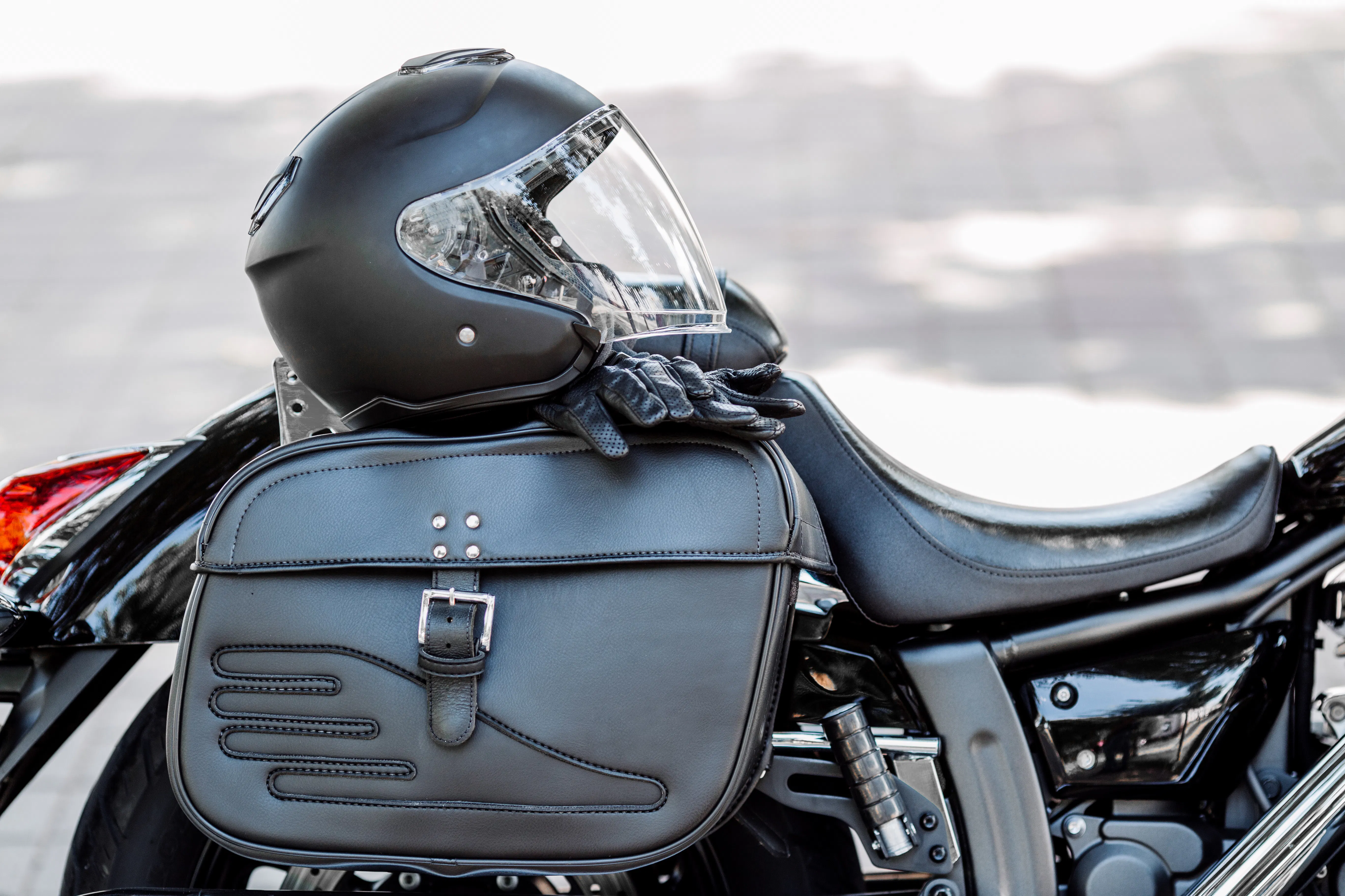 image of helmet and gloves on a motorcycle - best hot weather motorcycle gear