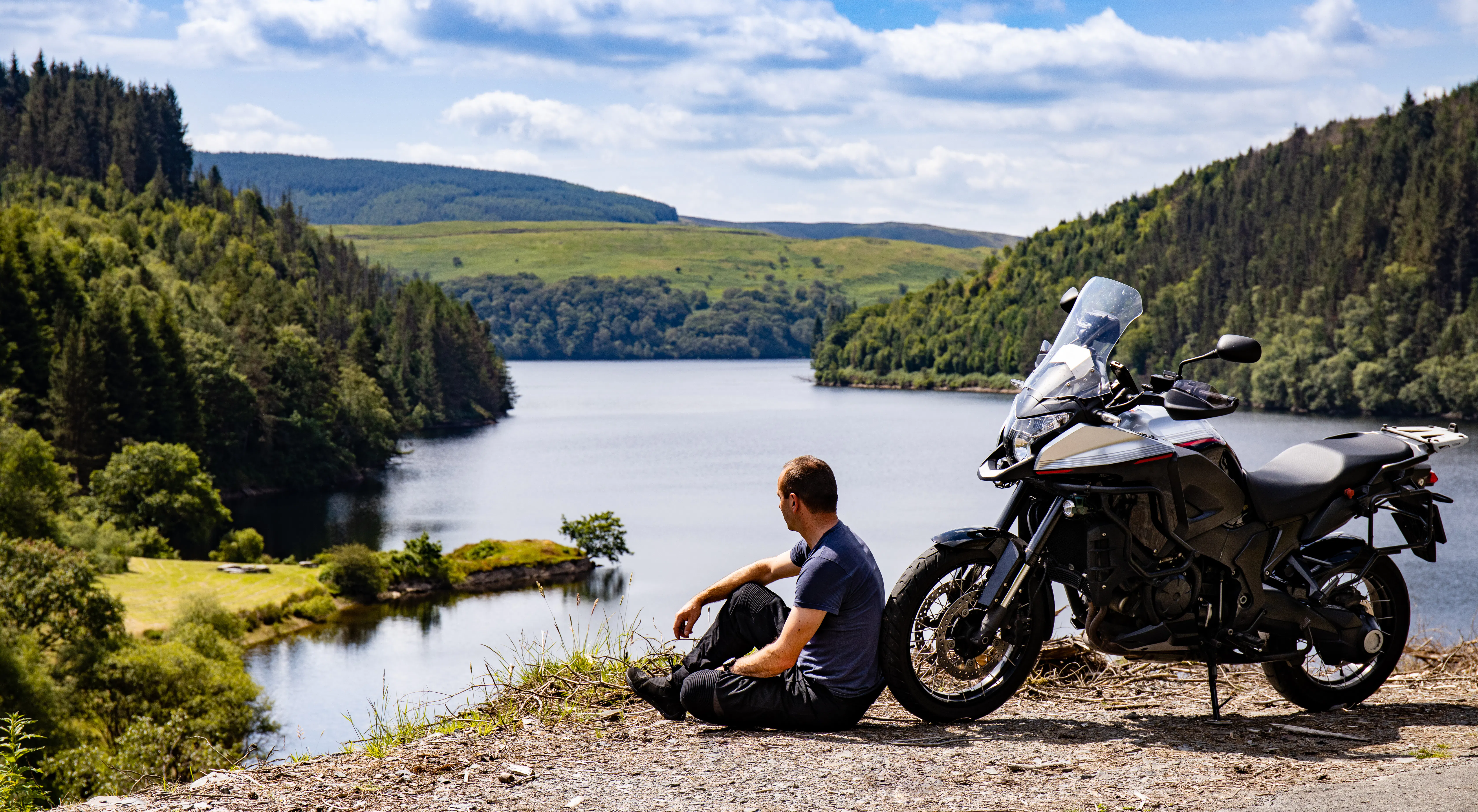 image of man and his adventure motorcycle - best middleweight adventure bikes for 2026