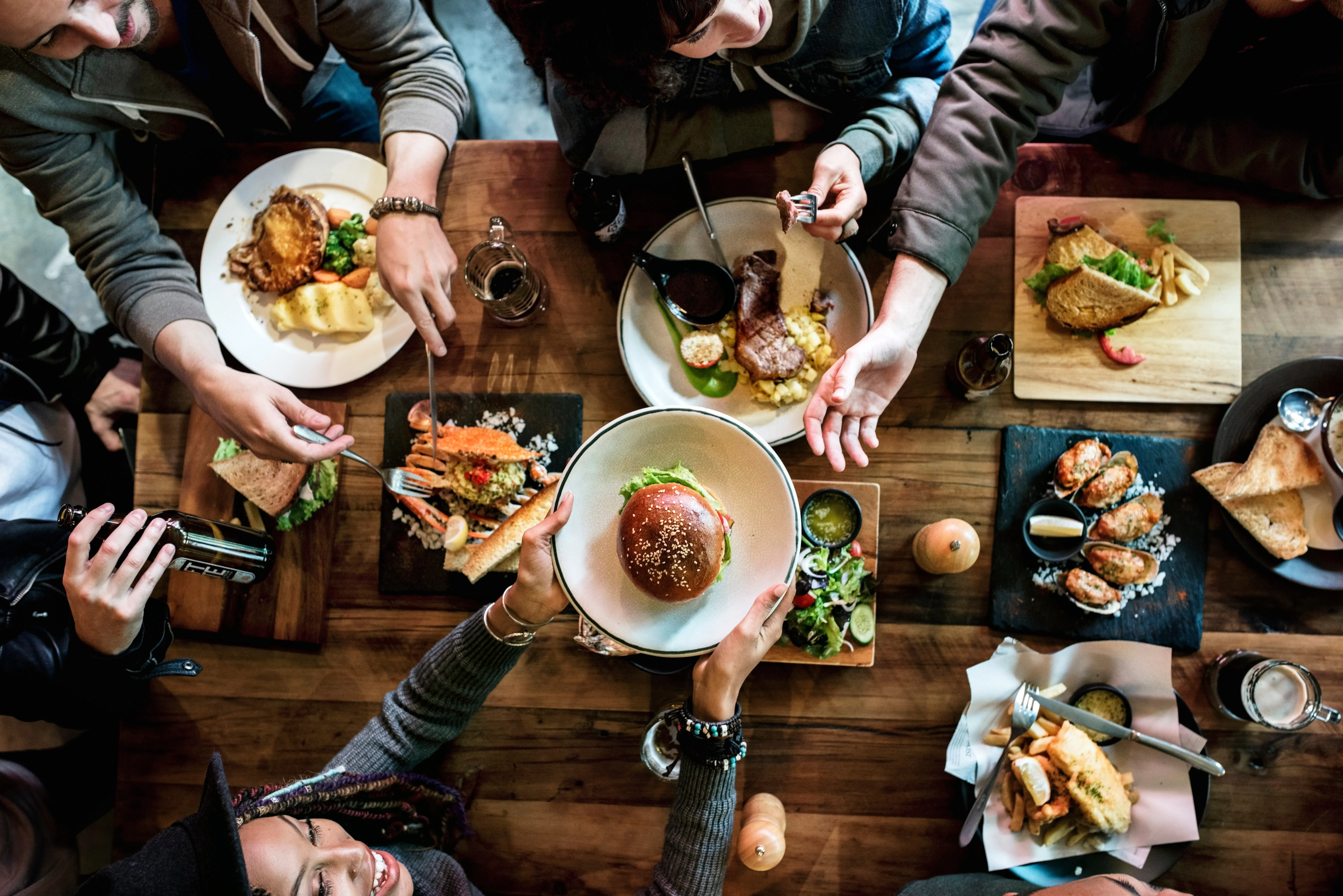 Tacos and Mexican street food spread on a wooden table in Los Angeles