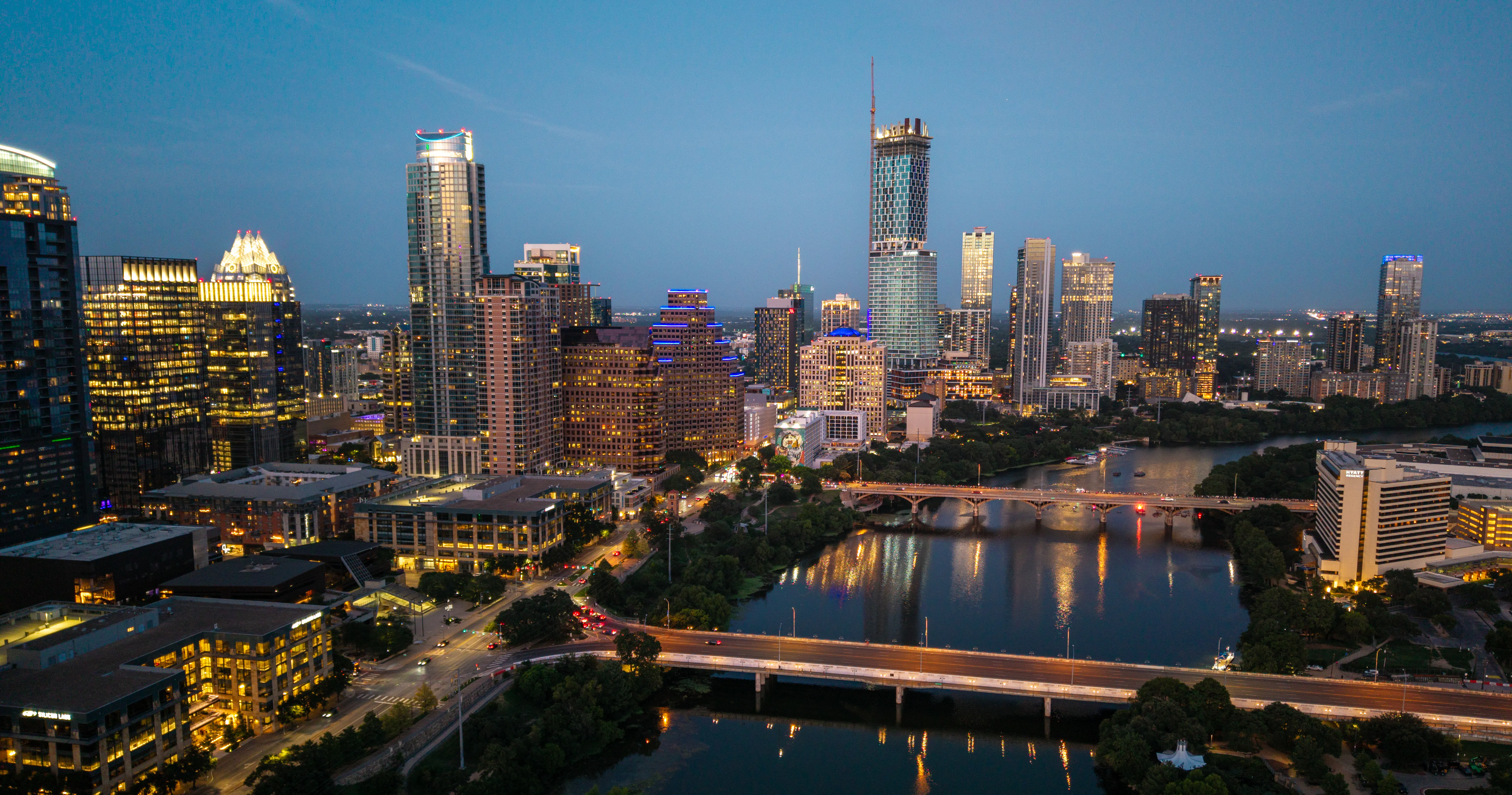 Austin skyline with the Colorado River and bluebonnets in spring