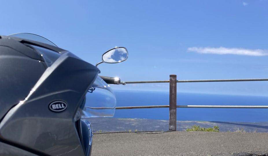 Yamaha v star motorcycle parked along a look out over the ocean in Hawaii