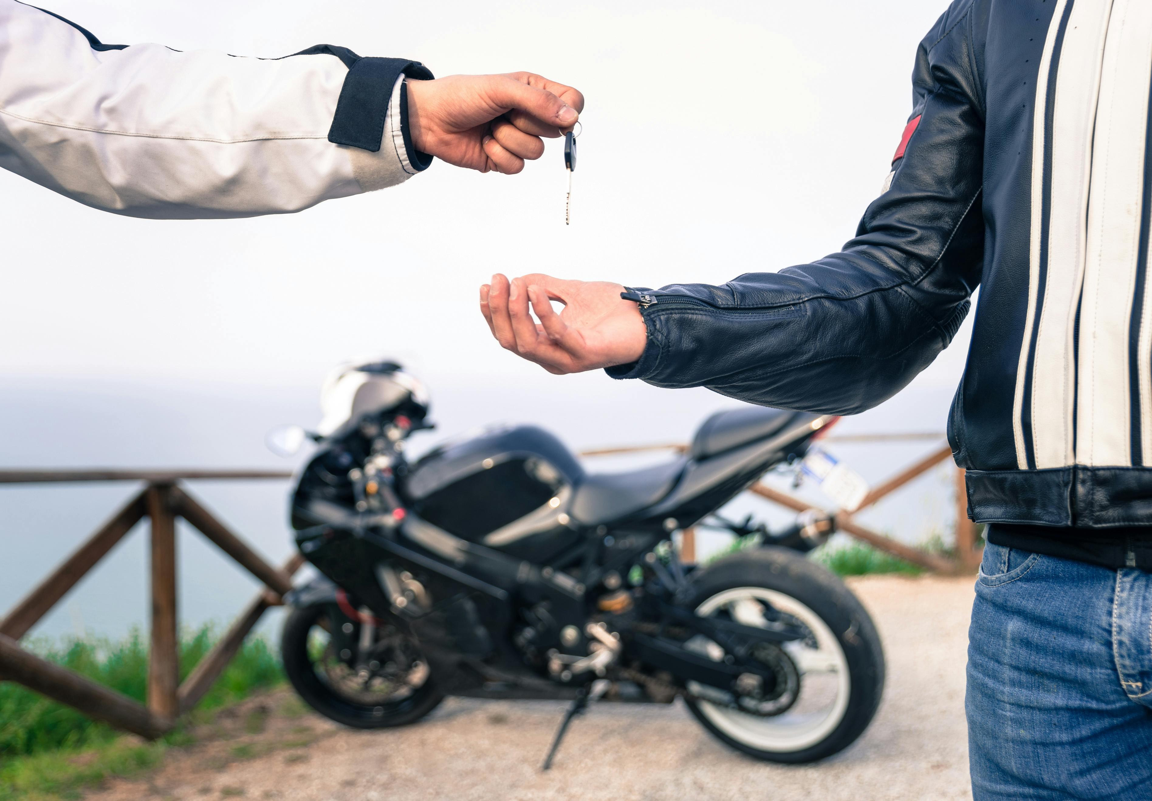 owner decides to rent motorcycle on Riders Share and exchanges keys with the rider