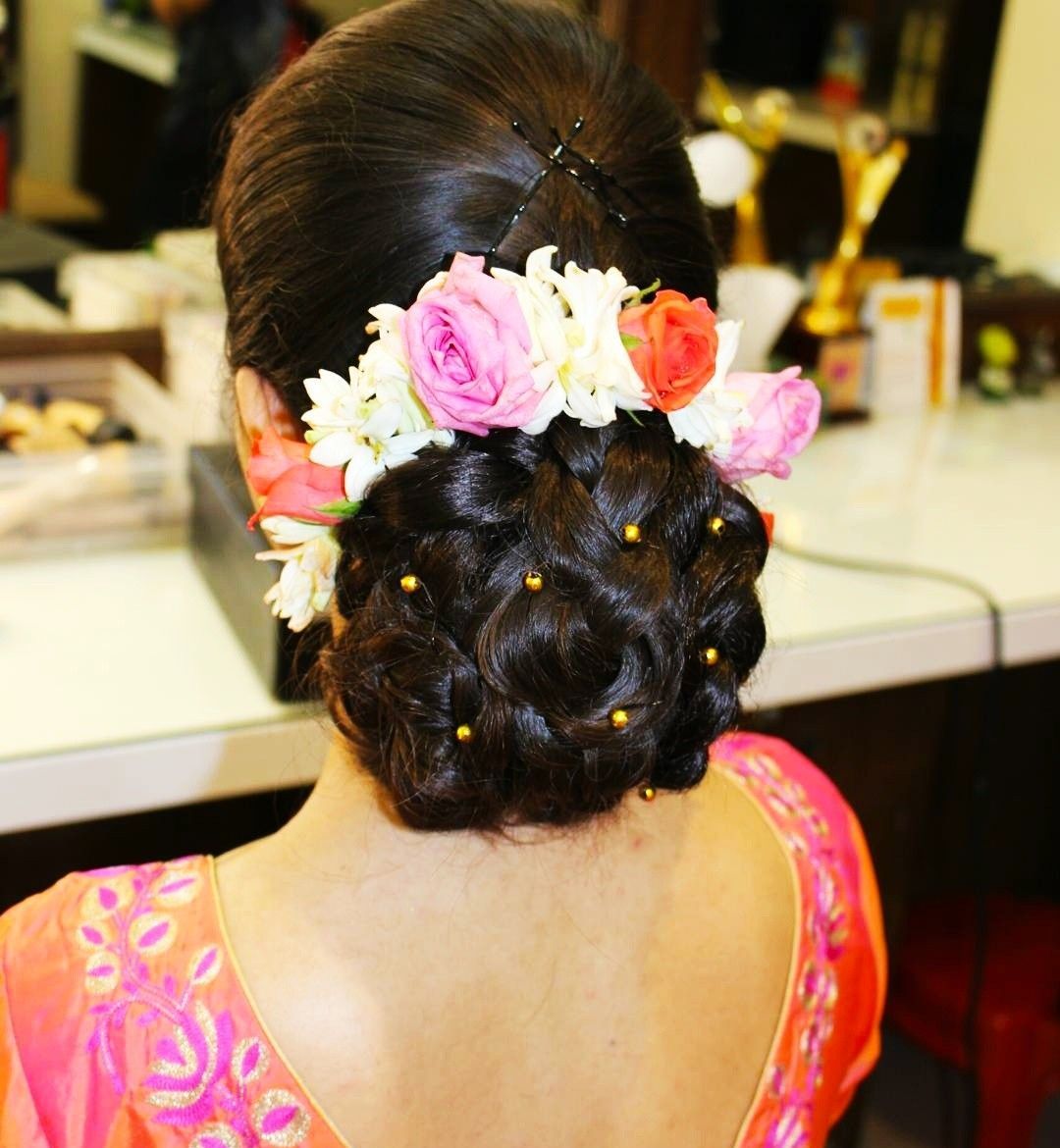 Bun hairstyle with flower arrangement Archives  Threads  WeRIndia