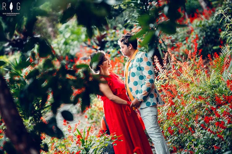Pre-wedding photography of a couple in a picnic garden
