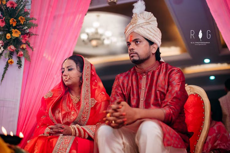 Groom and bride sitting in their wedding