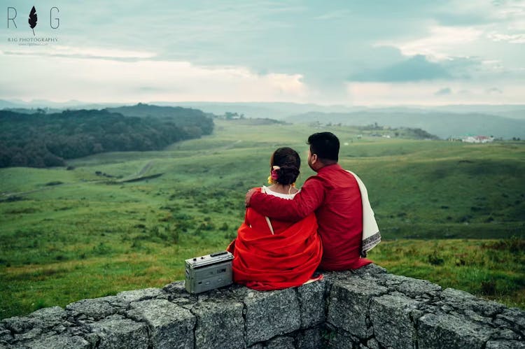 Couple posing backwards for their pre-wedding photography shoot