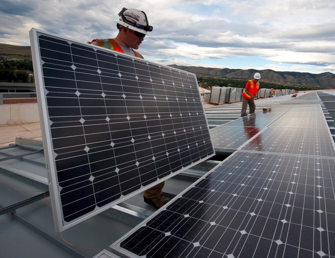 Solar technicians layout a utility-scale solar array.