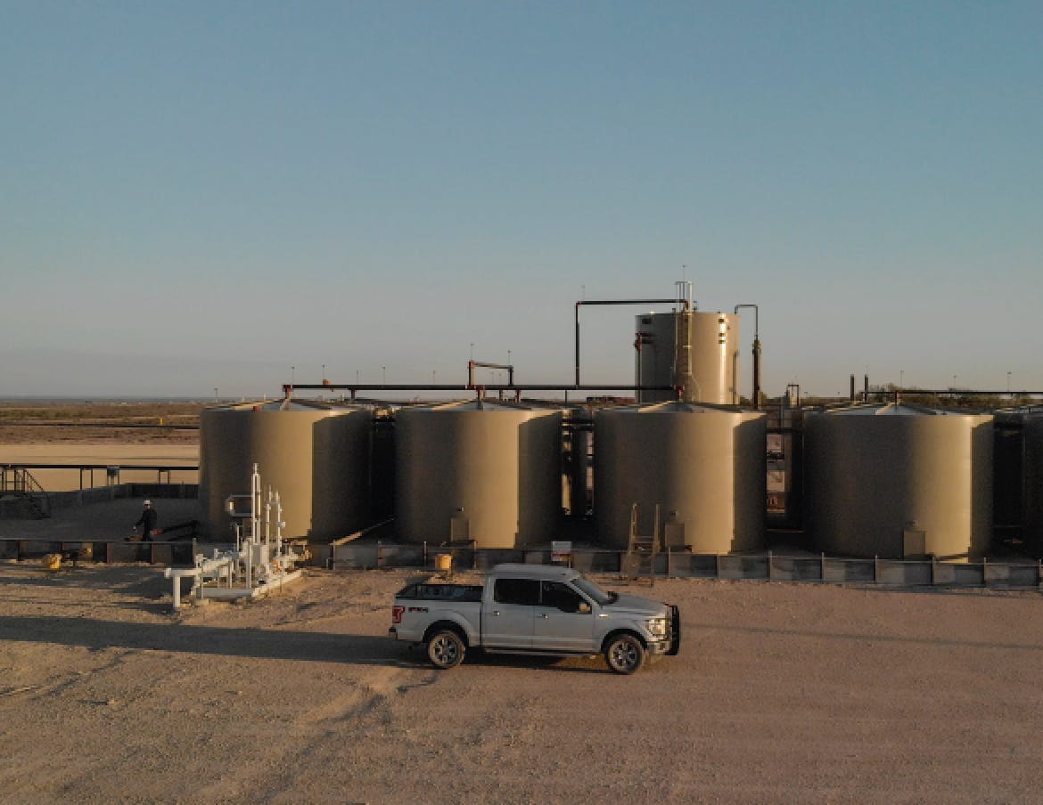 Drilling site water storage at sunset.